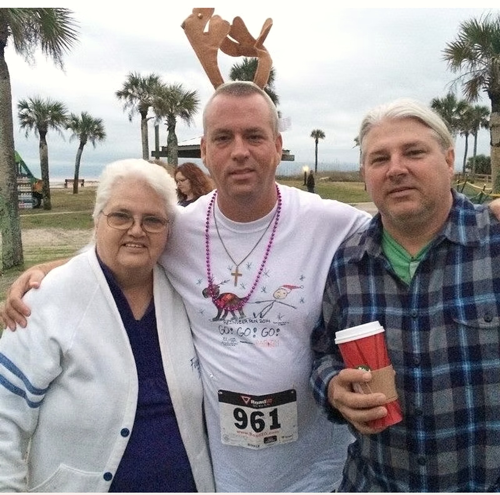 Founder Mary Frances Vest with her son Christopher and family at a community run in Fernandina Beach.
