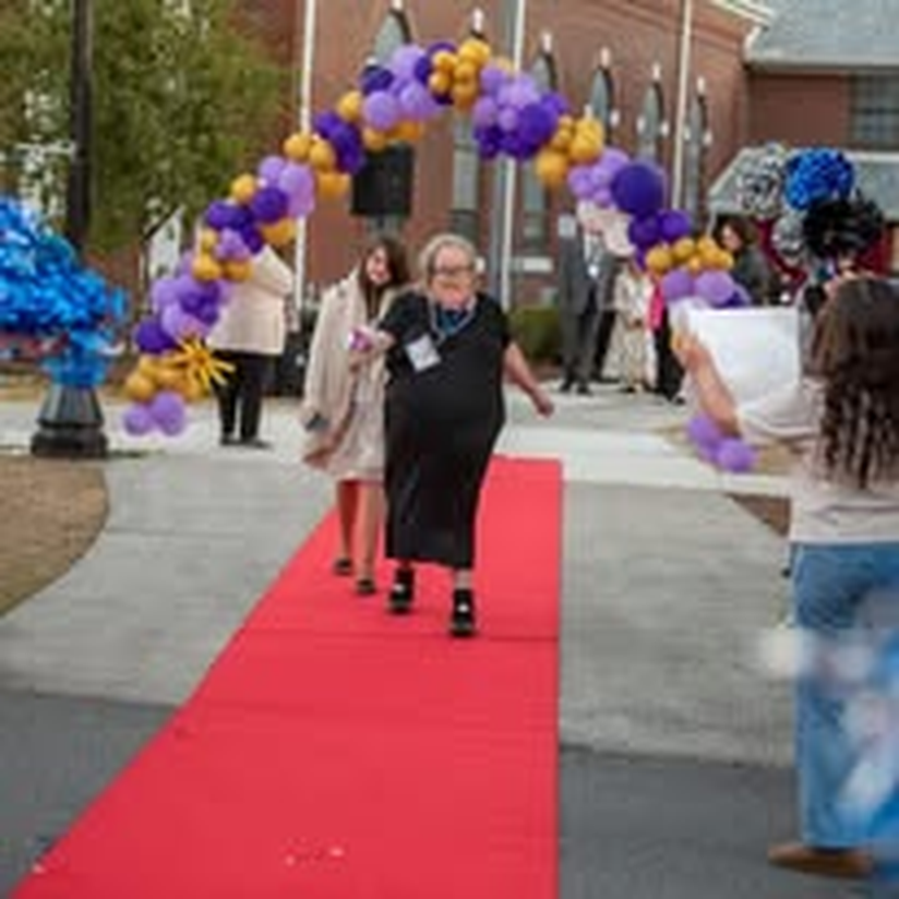 An individual making her way down the red carpet at the gala.