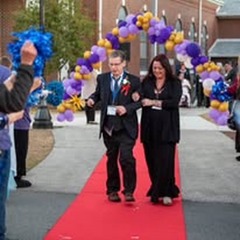 A young couple dressed up for the community gala.