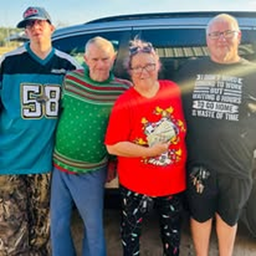 A group photo in festive sweaters during a holiday outing.
