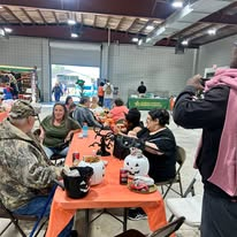 Guests sharing a meal at the community dinner.